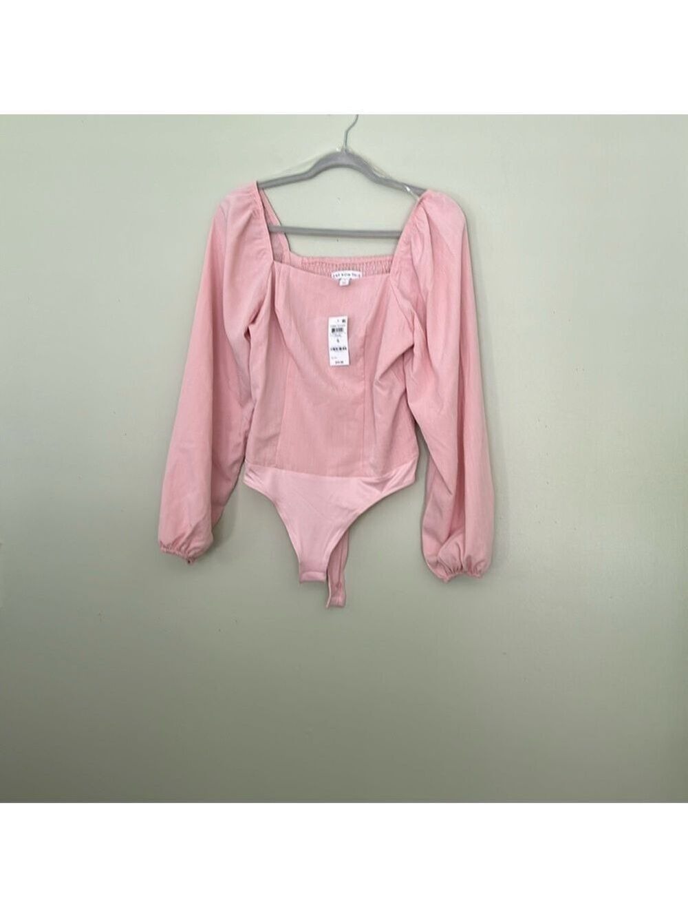 AND NOW THIS bodysuit in lotus pink